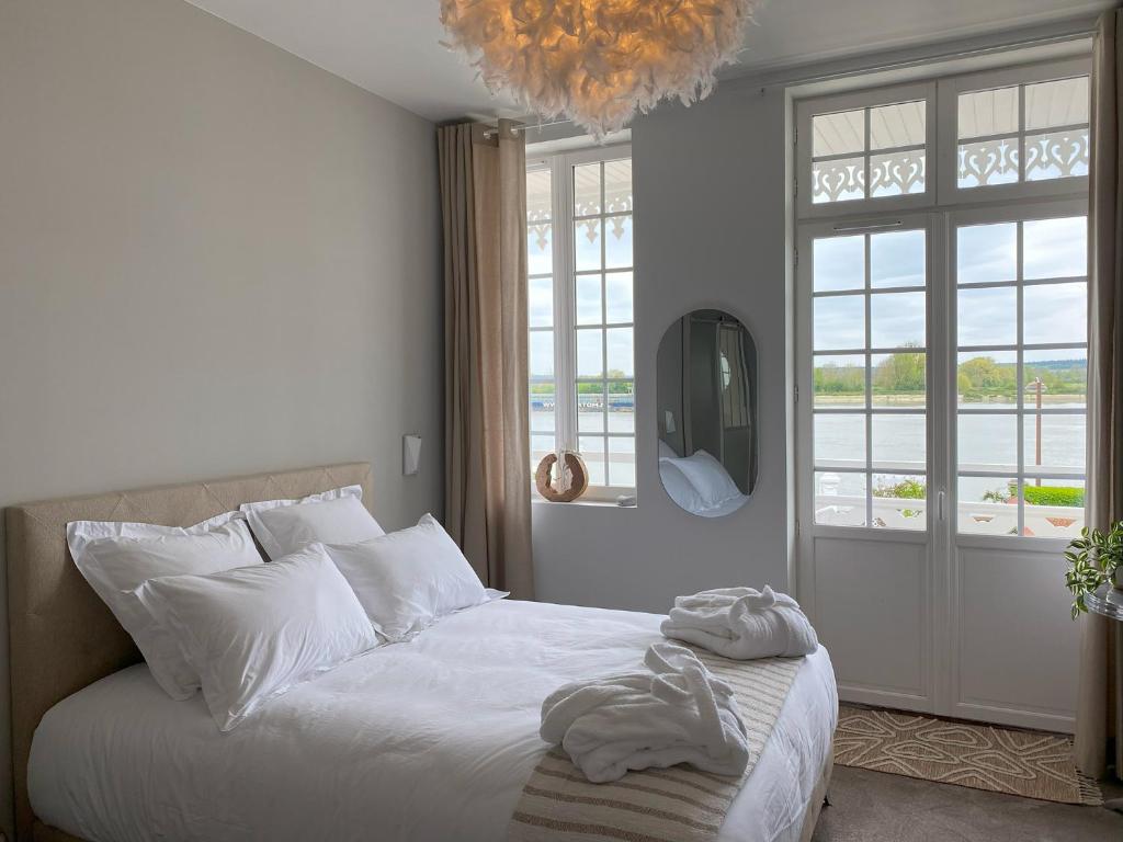 Postel nebo postele na pokoji v ubytování White House, maison d'hôtes