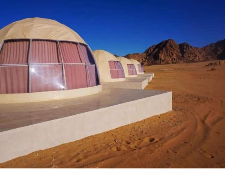 a building in the middle of the desert at Talal Wadi Rum in Wadi Rum