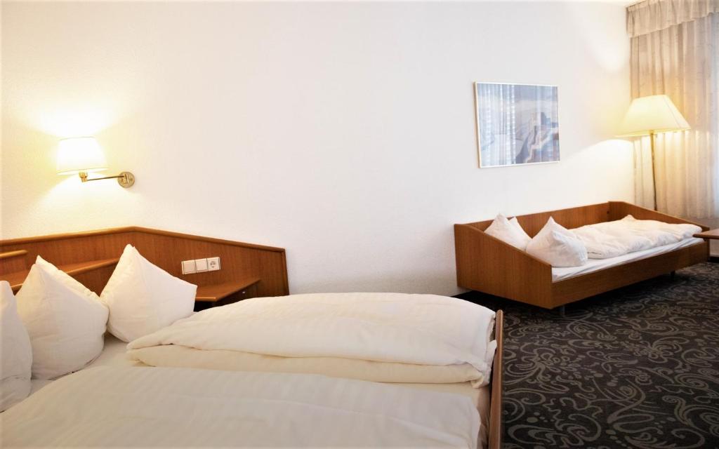 Postel nebo postele na pokoji v ubytování ALFA Hotel - Superior