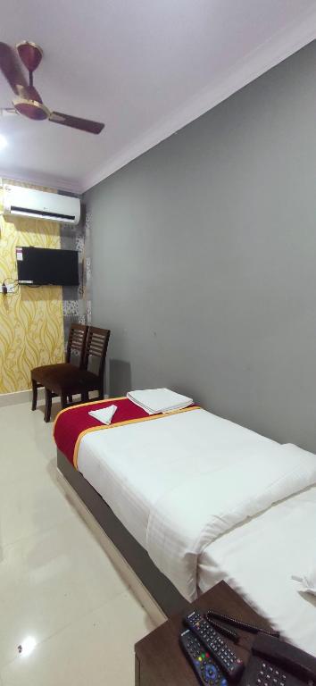 Postel nebo postele na pokoji v ubytování Hotel Sandhya