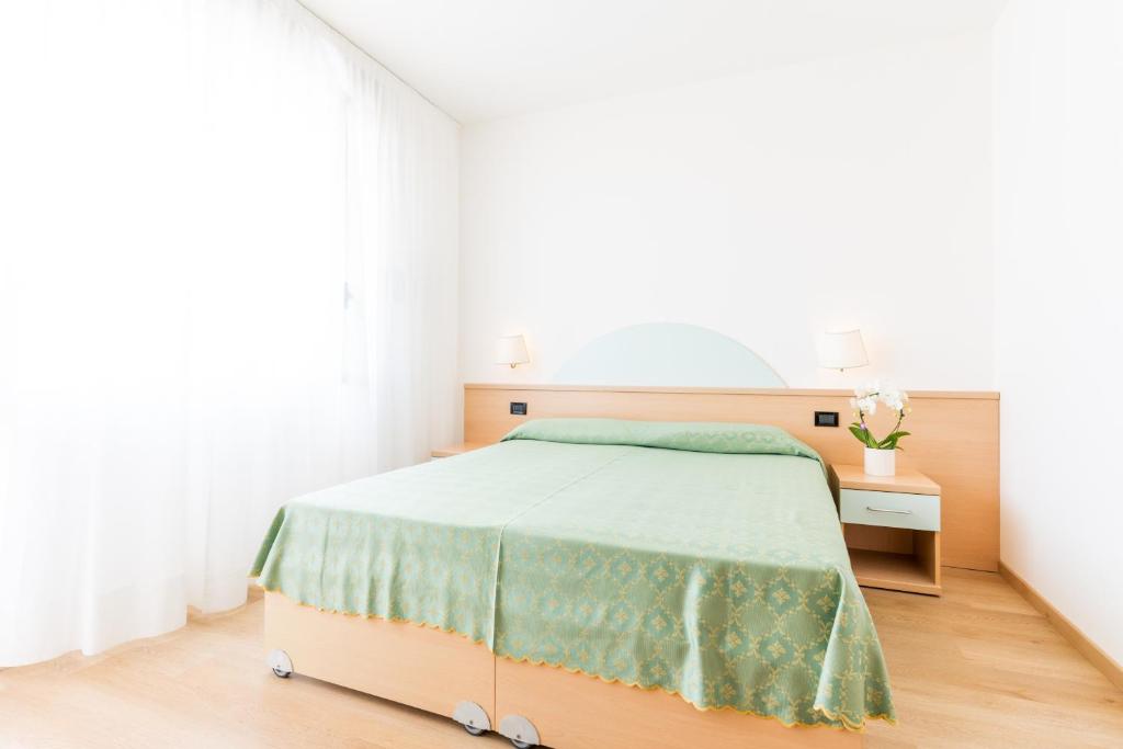 Postel nebo postele na pokoji v ubytování Hotel Europa