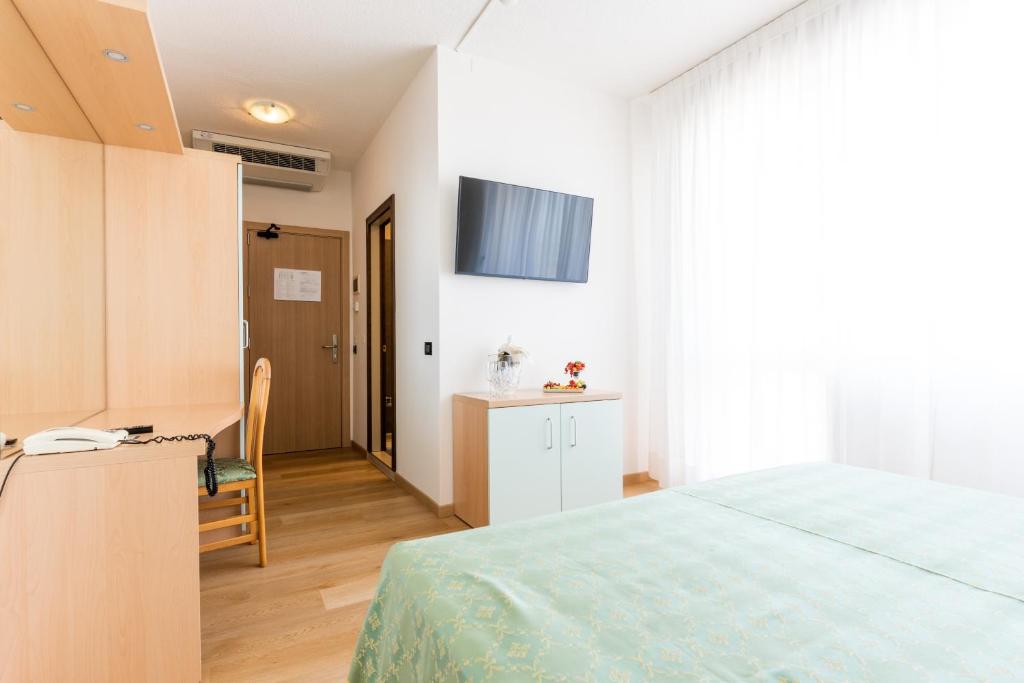 Postel nebo postele na pokoji v ubytování Hotel Europa