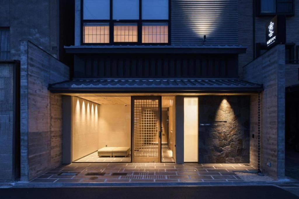 a store front of a building at night at Stay SAKURA Kyoto Gion Miyagawacho in Kyoto