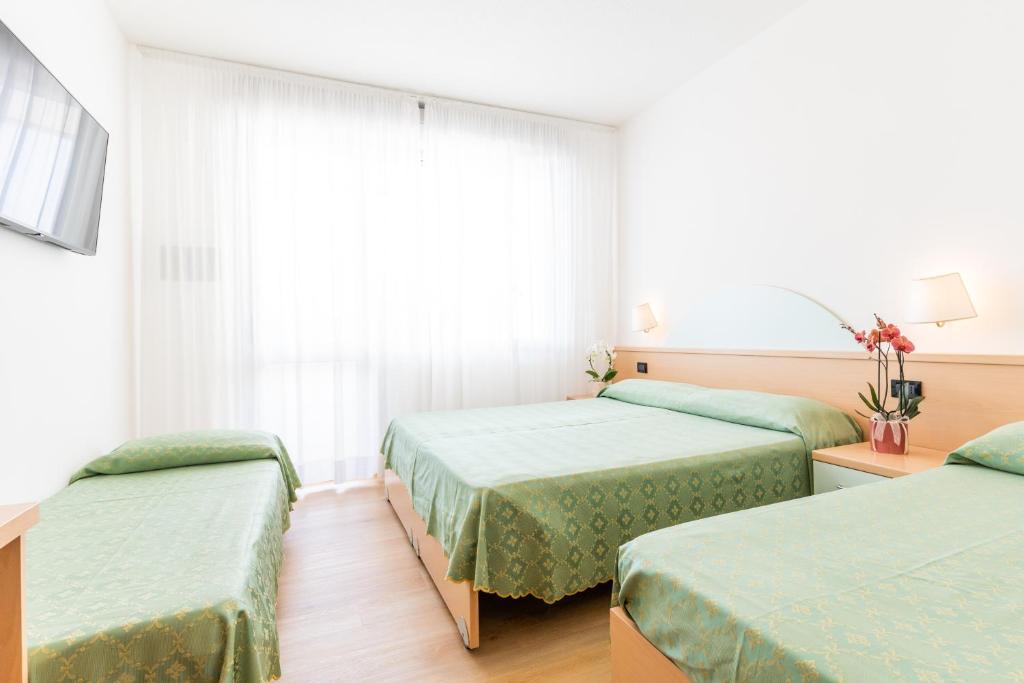 Postel nebo postele na pokoji v ubytování Hotel Europa