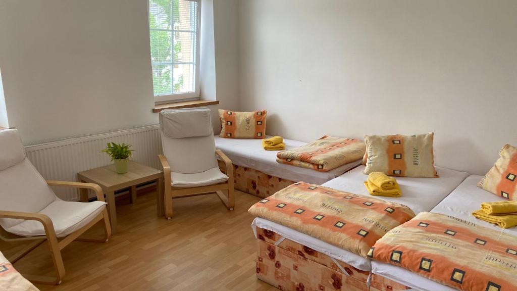 Postel nebo postele na pokoji v ubytování Penzion Bamako