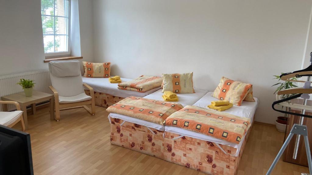 Postel nebo postele na pokoji v ubytování Penzion Bamako