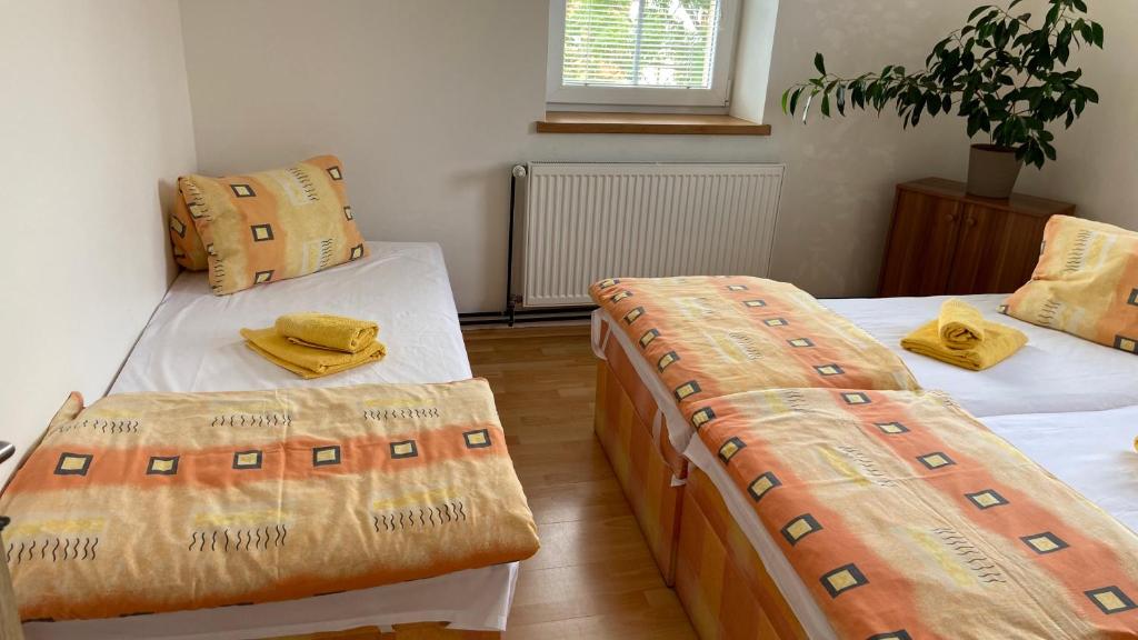Postel nebo postele na pokoji v ubytování Penzion Bamako