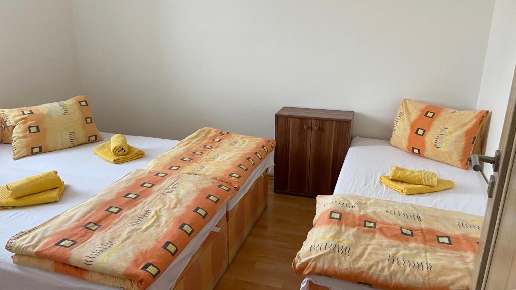 Postel nebo postele na pokoji v ubytování Penzion Bamako