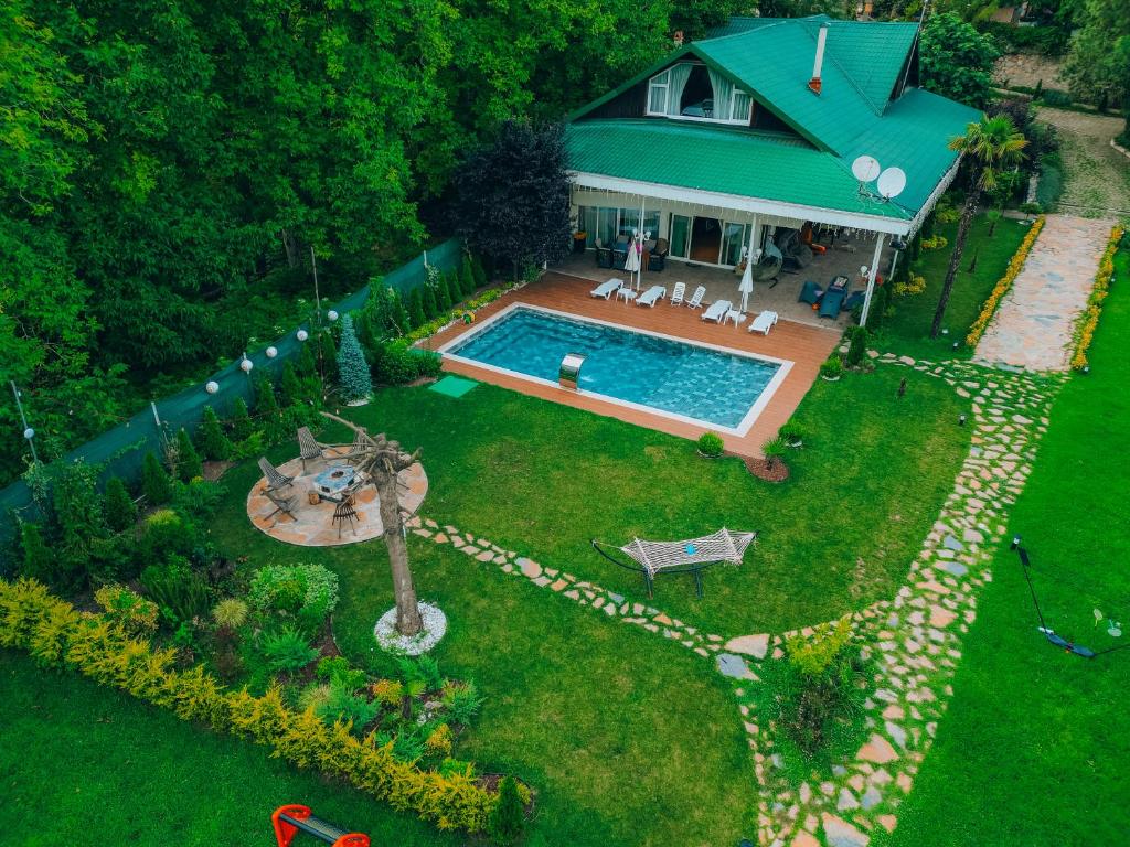 an aerial view of a house with a swimming pool at Lotus Sapanca-Private Villa with private Pier and heated pool in Serdivan