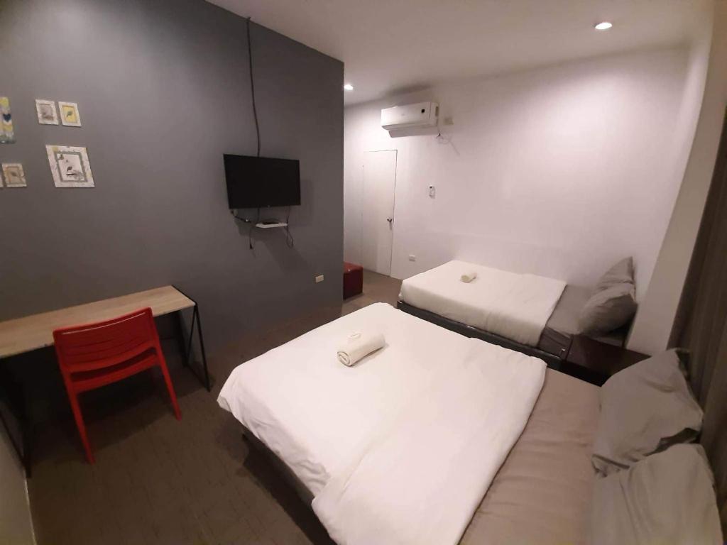 Postel nebo postele na pokoji v ubytování Hometown Hotel - Lacson Bacolod