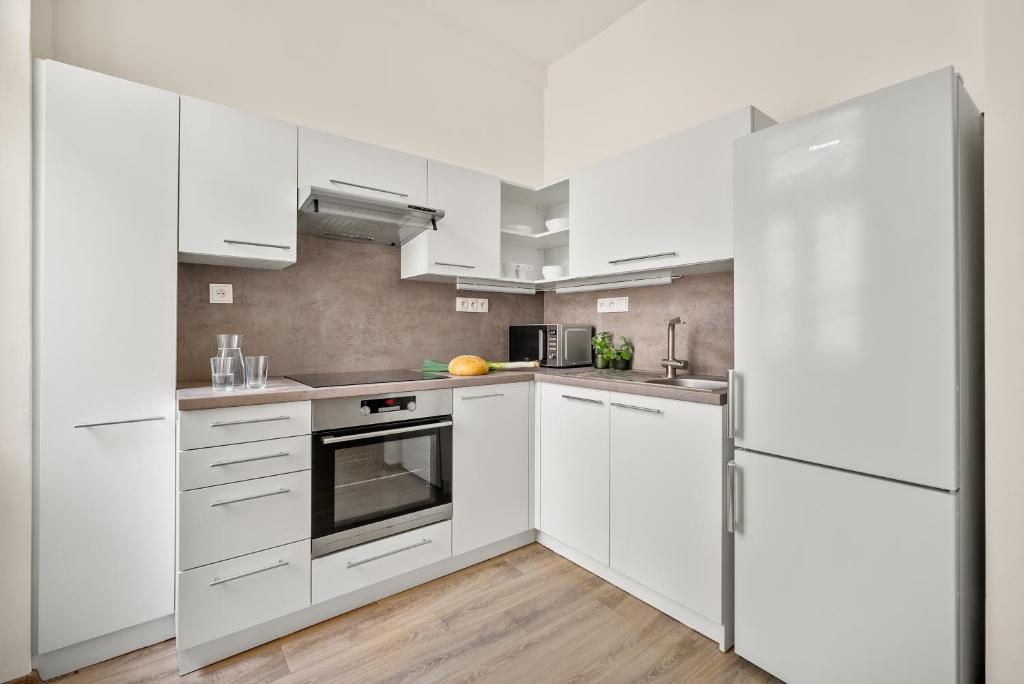 Kuchyň nebo kuchyňský kout v ubytování Enjoy Downtown Boutique Apartments #13 by Goodnite cz