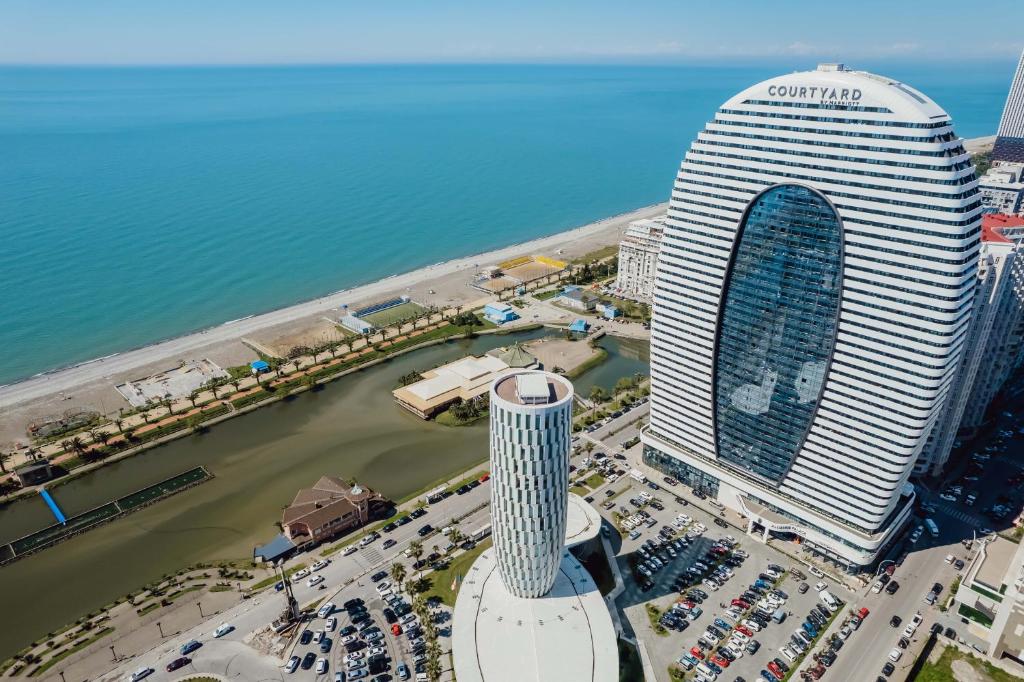 an aerial view of the corina towers in a city at Alliance Palace Aparthotel in Batumi