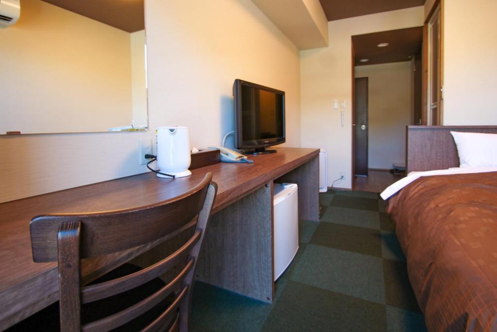 Postel nebo postele na pokoji v ubytování Ooedo Onsen Monogatari Hotel Shinko