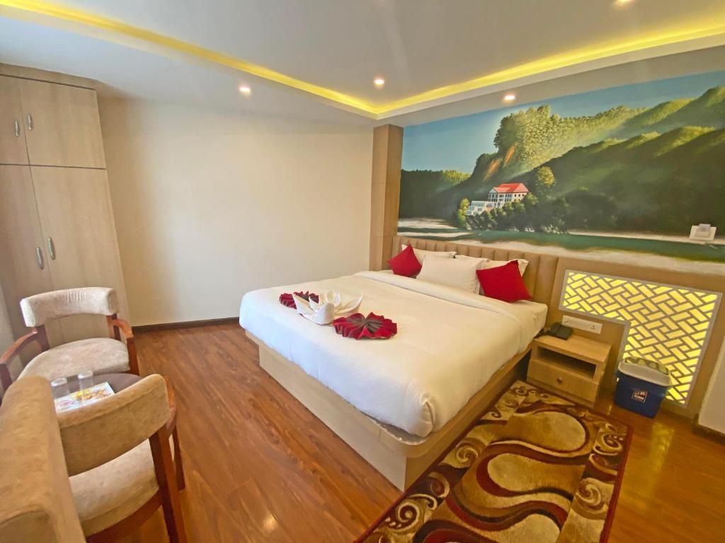 Postel nebo postele na pokoji v ubytování Hotel Malati