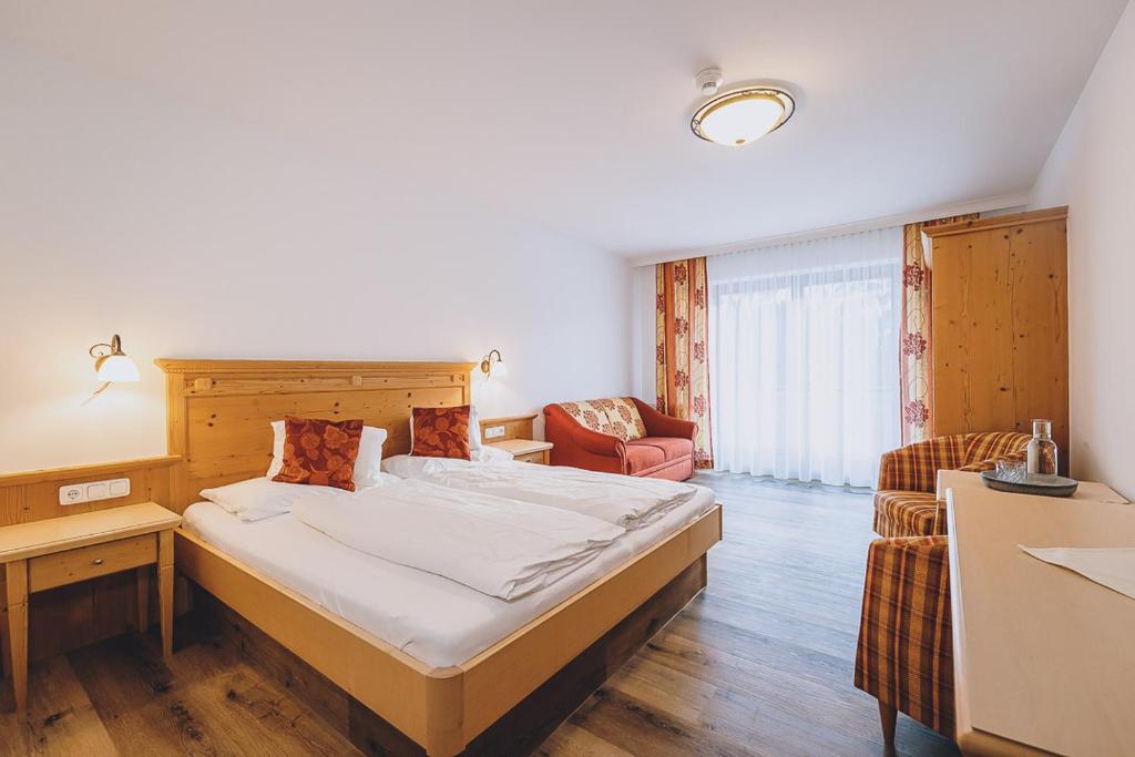 Rúm í herbergi á Hotel Vorderronach