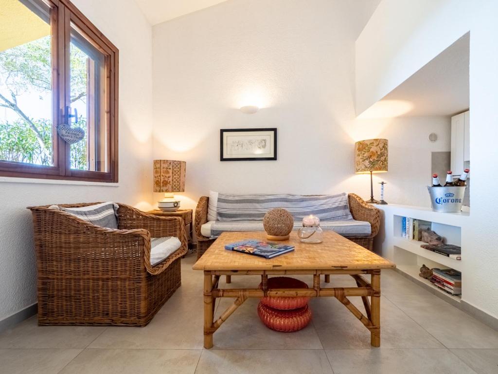 a living room with a couch and a table at Casa Flaminia Villasimius in Villasimius