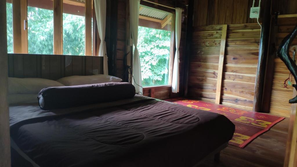Postel nebo postele na pokoji v ubytování PeaMoo Homestay