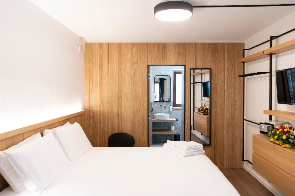 Postel nebo postele na pokoji v ubytování Hotel SALEI