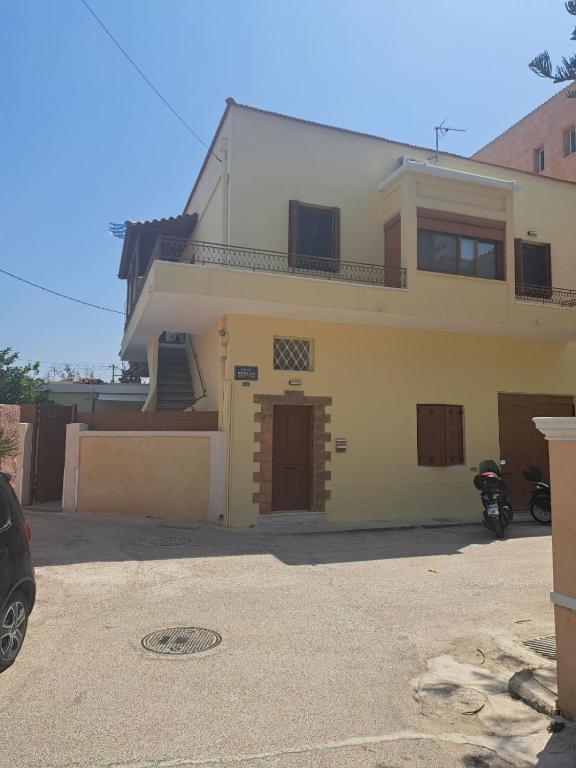 a house with a motorcycle parked in front of it at Castle luxury home in Chios