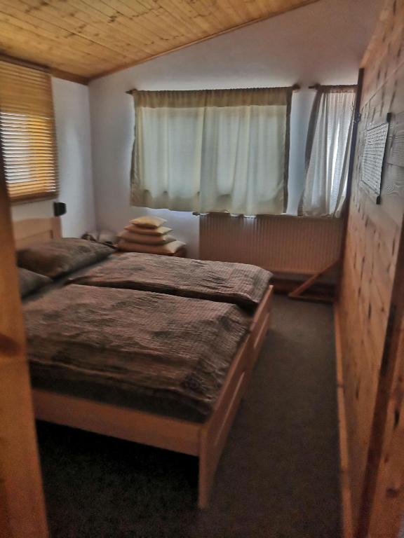 Postel nebo postele na pokoji v ubytování Ubytování v soukromí Klima
