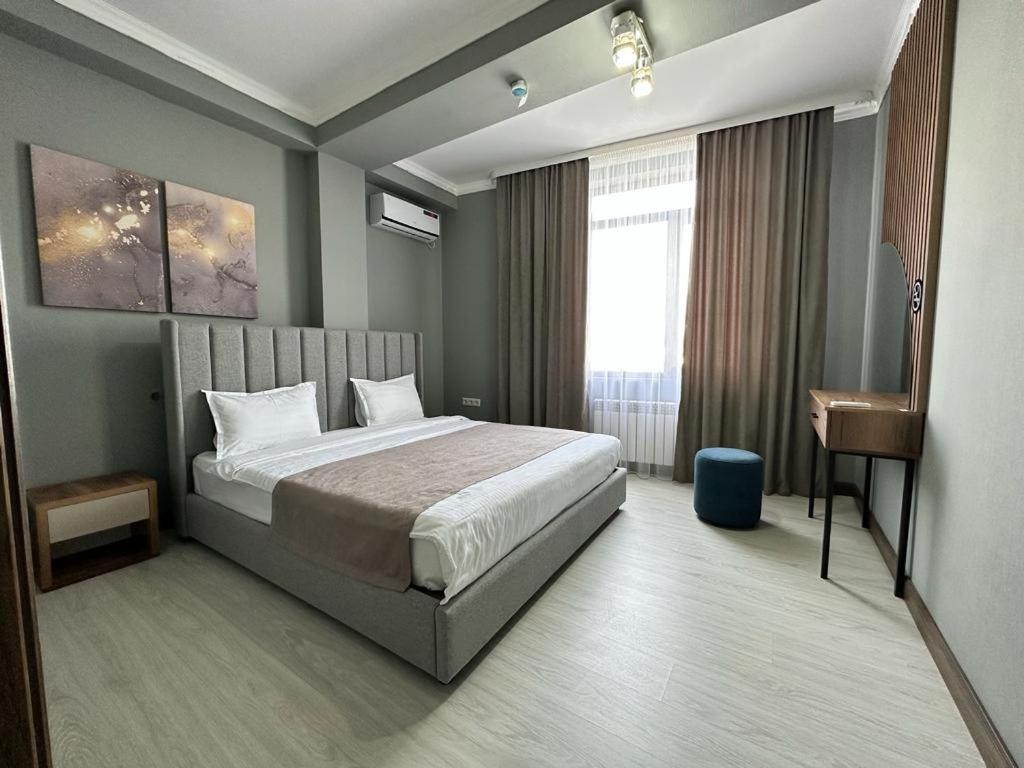 Postel nebo postele na pokoji v ubytování Lumarc Hotel