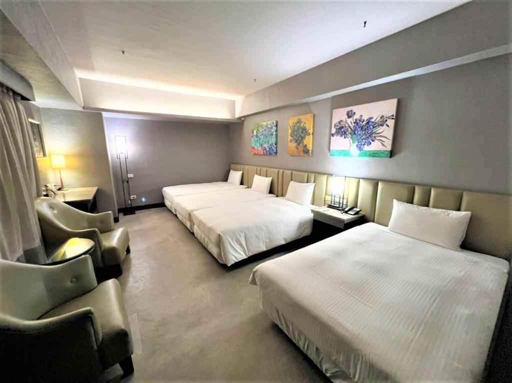Postel nebo postele na pokoji v ubytování Kaohsiung Ahotel