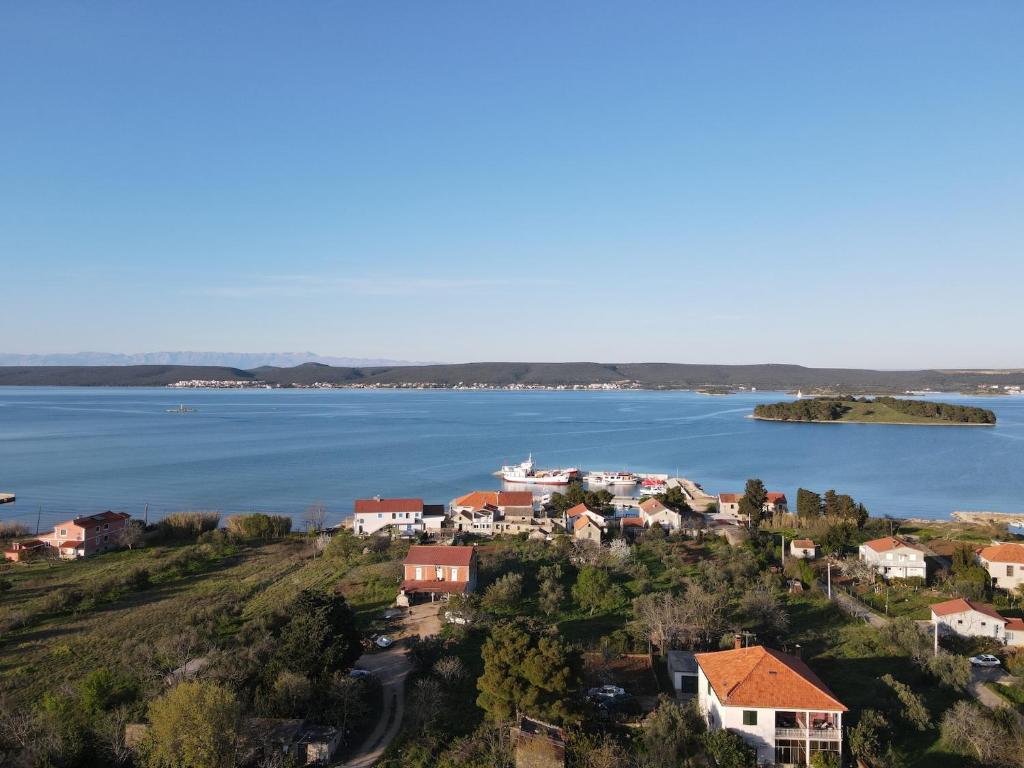 a small town on the shore of a body of water at Nar Apartment in Mrljane