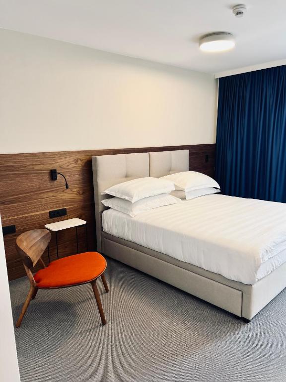 Postel nebo postele na pokoji v ubytování Boutique Hotel Mirjam