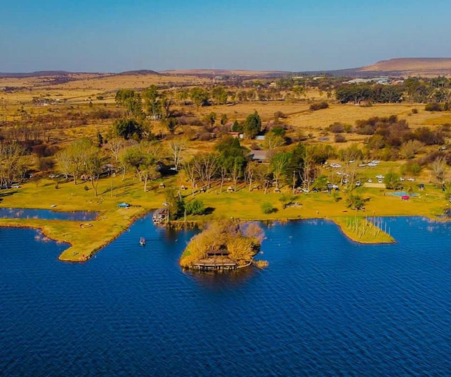 an island in the middle of a body of water at TangleWood Nature Estate in Potchefstroom