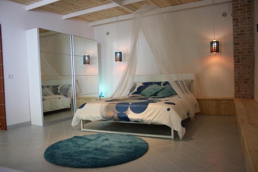 a bedroom with a bed and a large mirror at Blue B&B in Formia