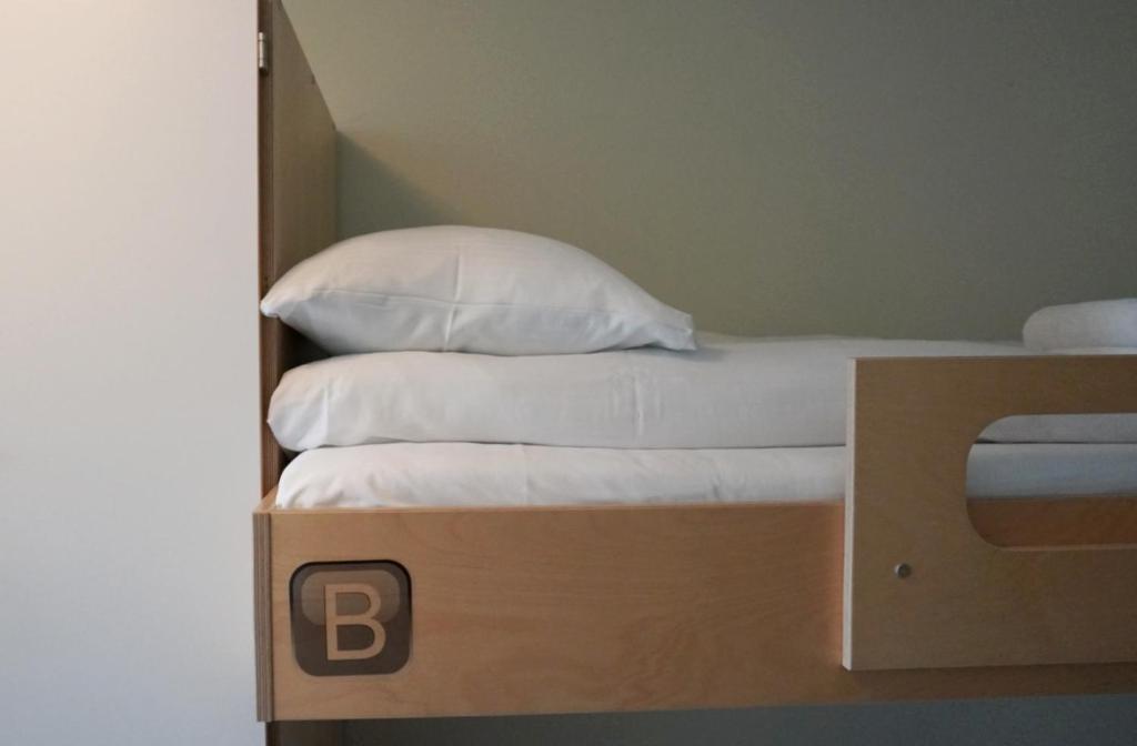 Postel nebo postele na pokoji v ubytování Rumi Hostel