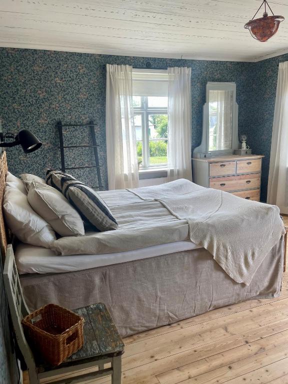 Postel nebo postele na pokoji v ubytování Gårdsfrun B&B