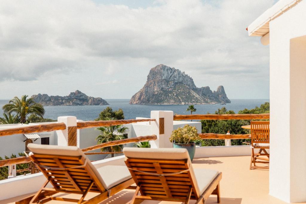 a view of the ocean from the balcony of a resort at Petunia Ibiza, a Beaumier hotel - Adults Only in Cala Vadella
