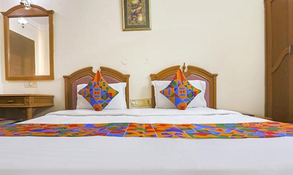 Postel nebo postele na pokoji v ubytování FabHotel Altus