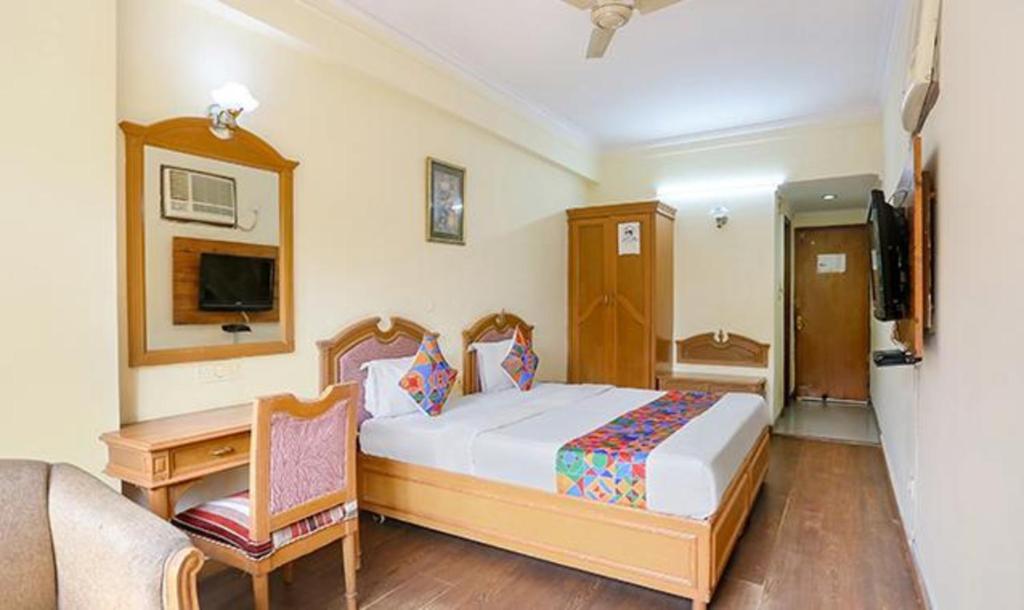 Postel nebo postele na pokoji v ubytování FabHotel Altus