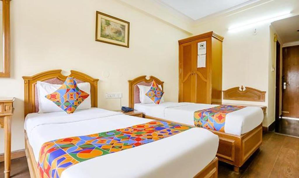 Postel nebo postele na pokoji v ubytování FabHotel Altus