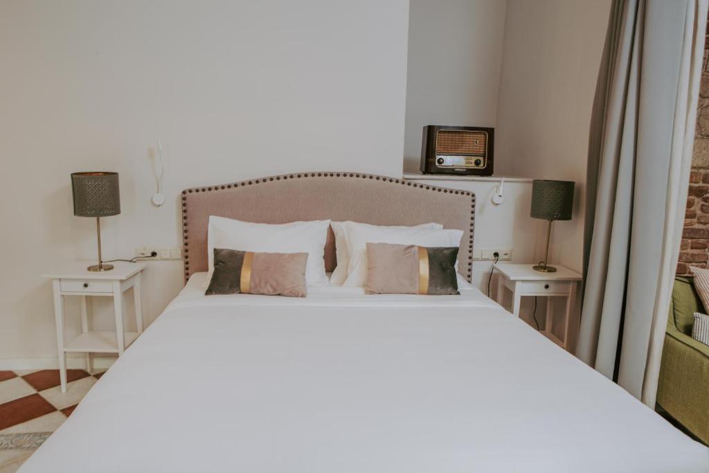 Posteľ alebo postele v izbe v ubytovaní Porta Medina Boutique Hotel