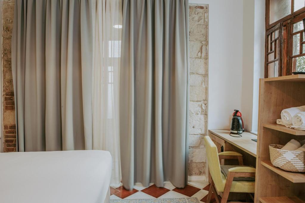 Posteľ alebo postele v izbe v ubytovaní Porta Medina Boutique Hotel