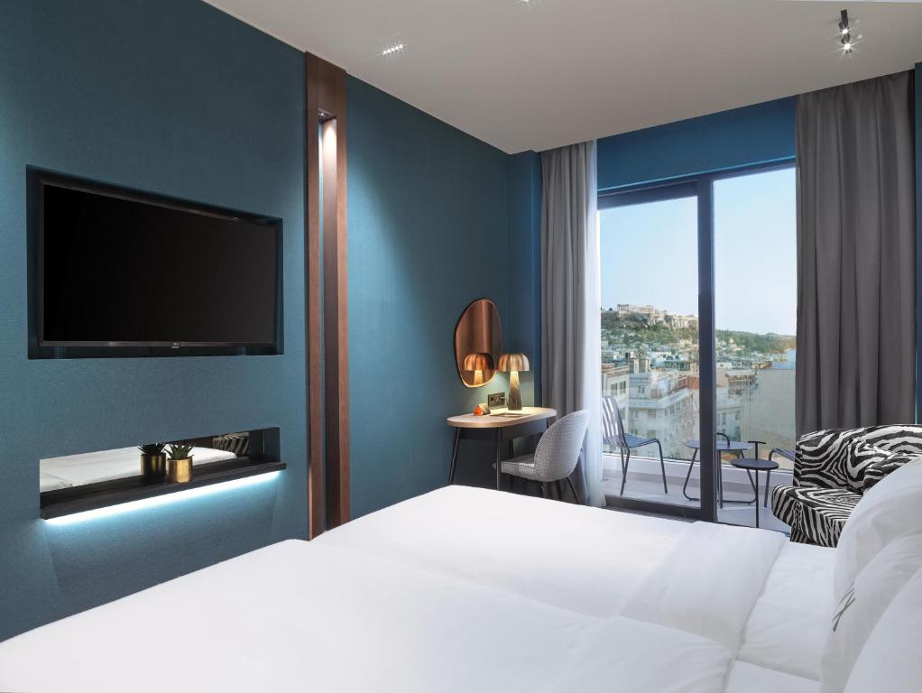 Postel nebo postele na pokoji v ubytování NYX Esperia Palace Hotel Athens by Leonardo Hotels