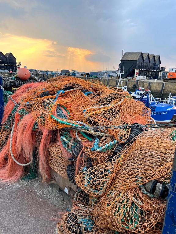 a pile of ropes and nets on a dock at The Bubble Hideaway - A Little Oasis near the Sea in Whitstable