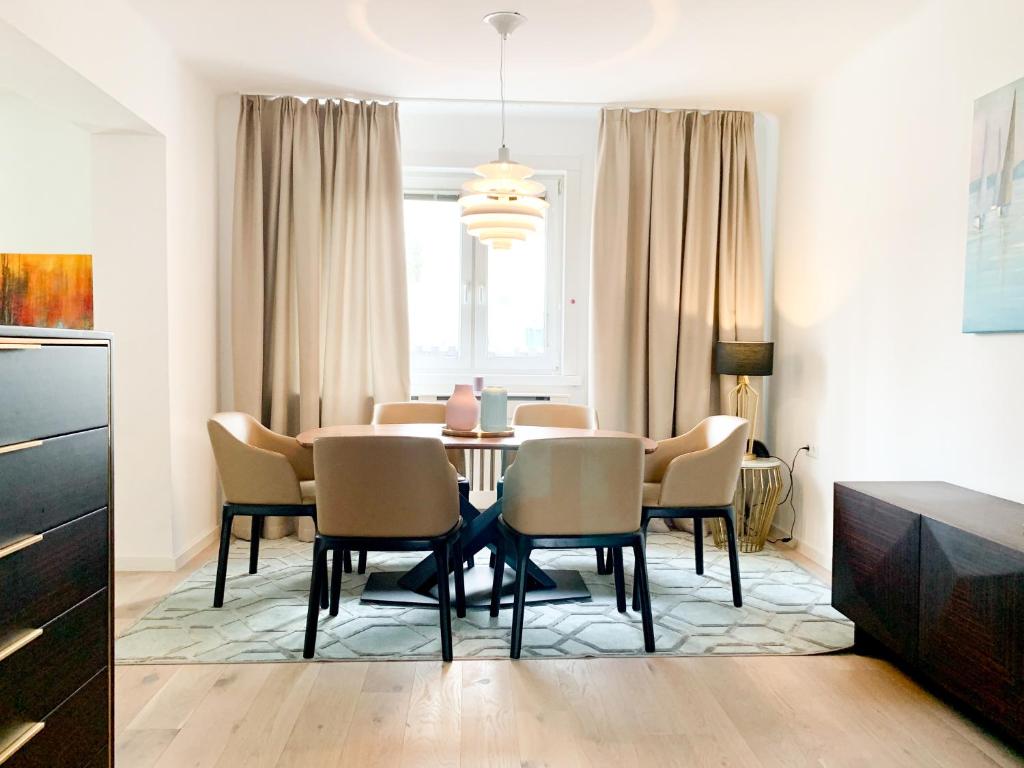a dining room with a table and chairs at Luxury suburb house - bright, quiet, beautiful in Vienna