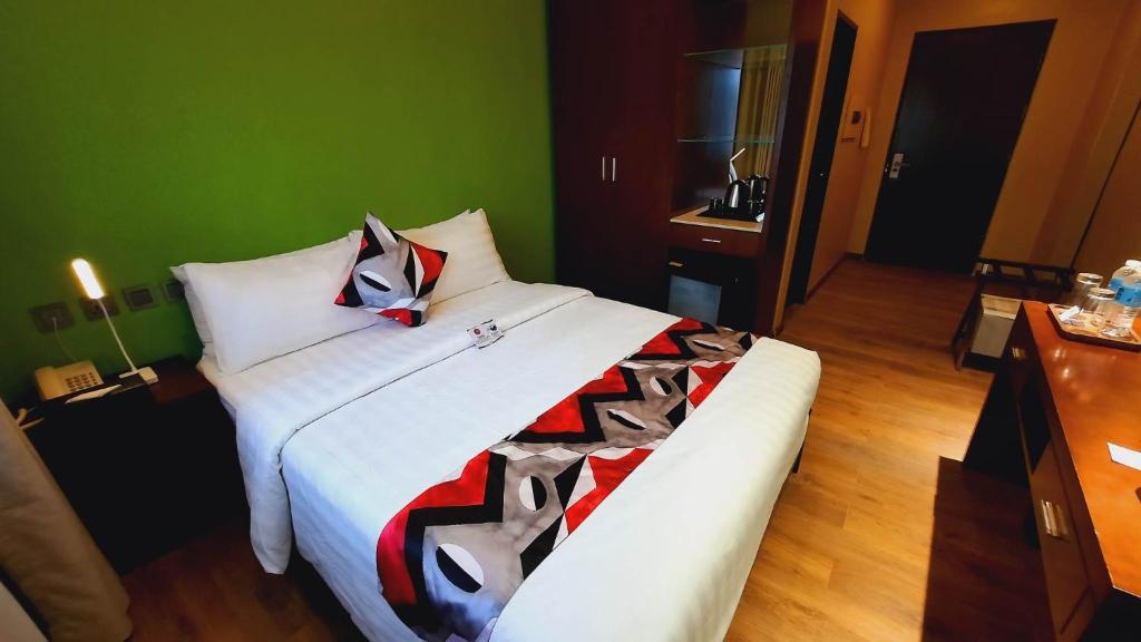 Postel nebo postele na pokoji v ubytování Kojo Hotels Cebu-Mandaue