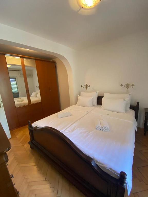 Postel nebo postele na pokoji v ubytování Apartments Grifone Lux