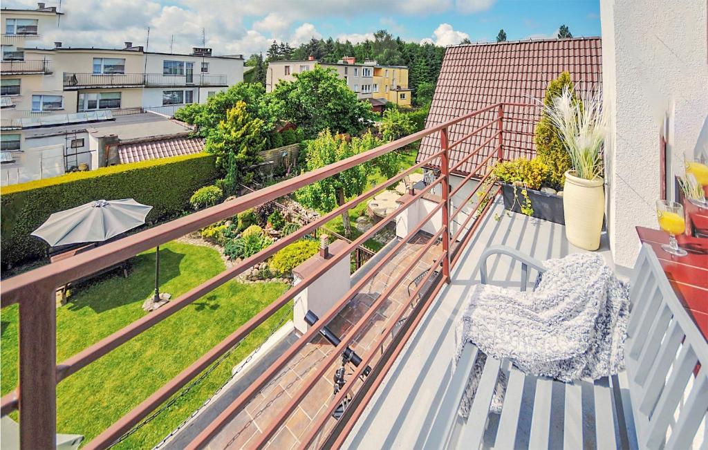 a balcony with a view of a yard at Nice Home In Kolobrzeg With Wifi in Kołobrzeg