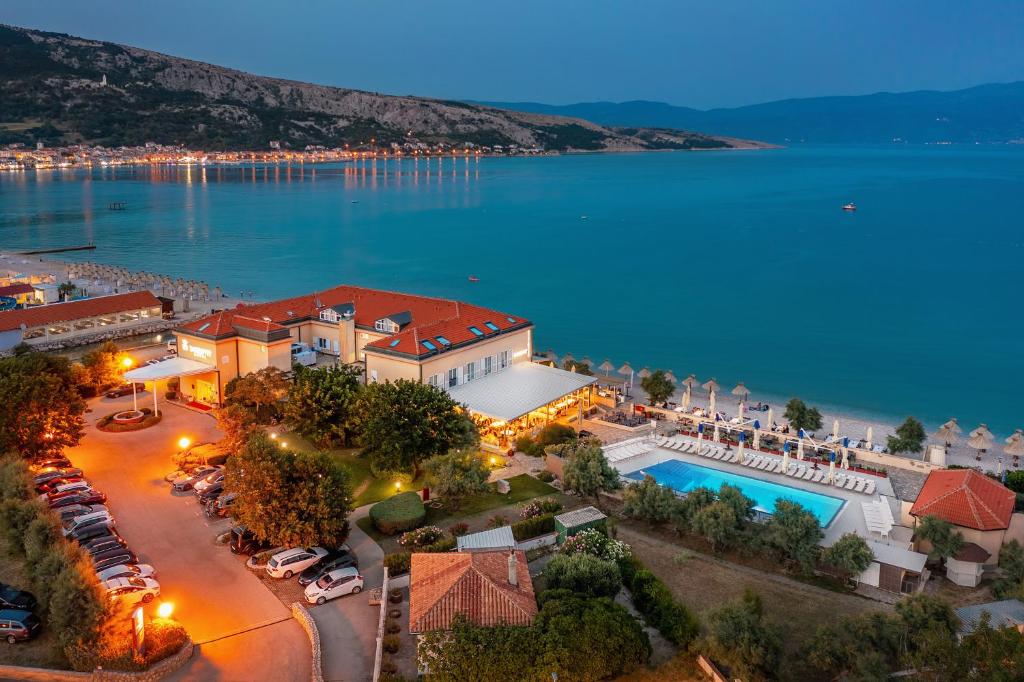 an aerial view of a resort with a swimming pool at Hotel Dobrovit in Baška