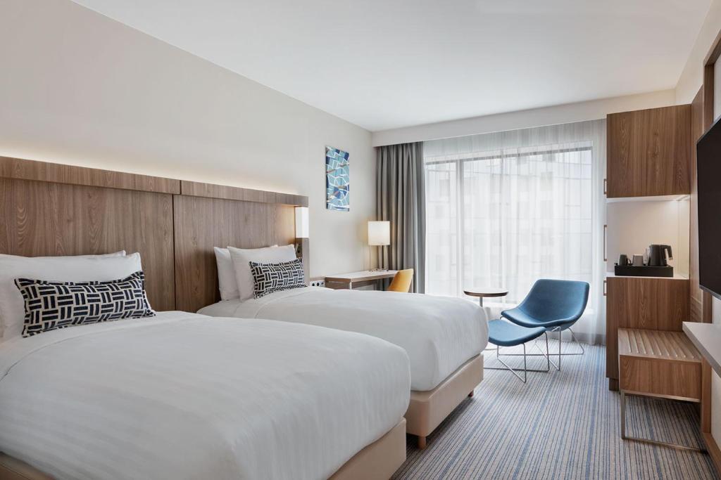Postel nebo postele na pokoji v ubytování Courtyard by Marriott Szczecin City