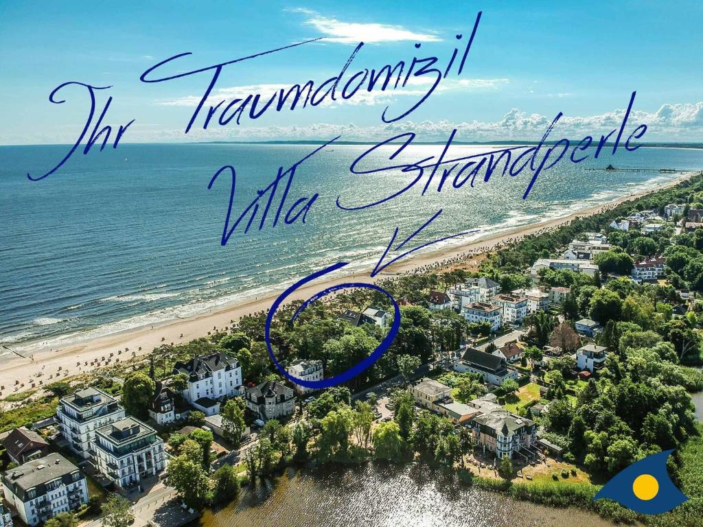an aerial view of the beach with the words hampton inn miramar villa at Villa Strandperle Whg 21 in Bansin