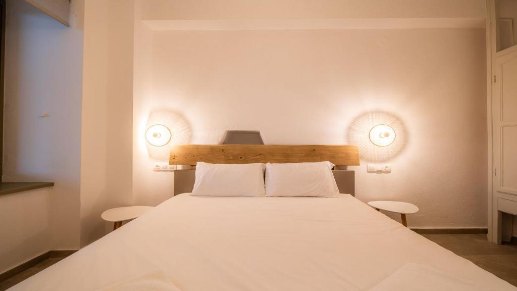 Posteľ alebo postele v izbe v ubytovaní Horto View Suites