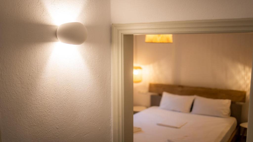 Posteľ alebo postele v izbe v ubytovaní Horto View Suites