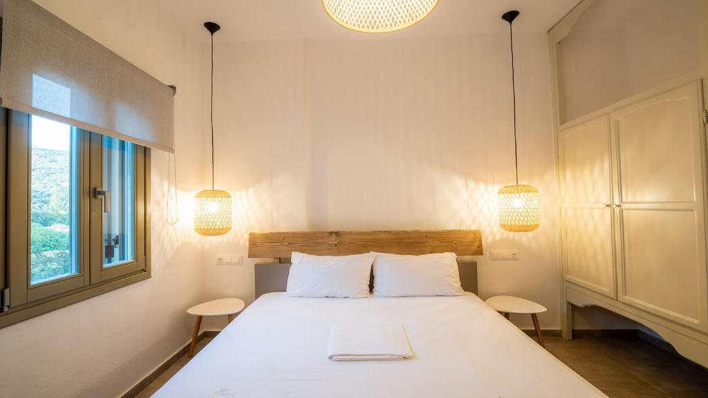 Posteľ alebo postele v izbe v ubytovaní Horto View Suites